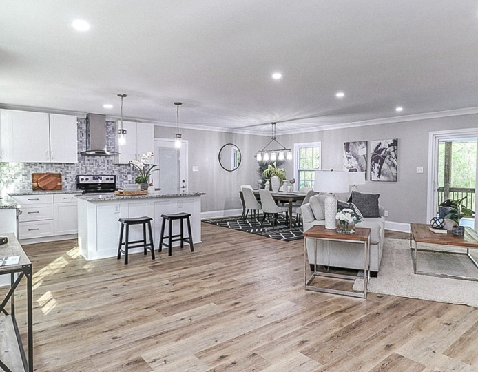 Wide open-concept plank flooring project completed by Dbest Flooring LLC